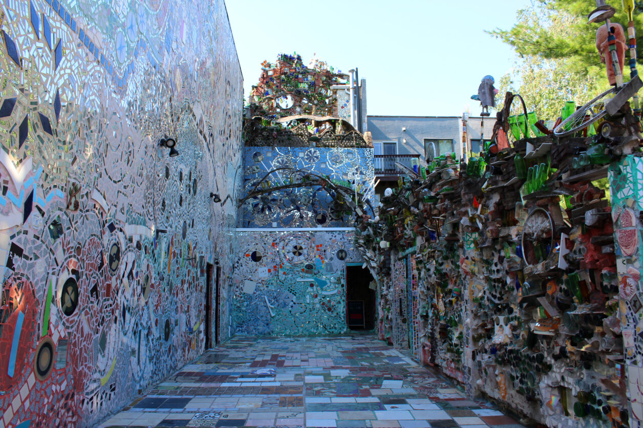 The large mosaicked courtyard outside Philadelphia's Magic Gardens, with mosaicked walls and floor.