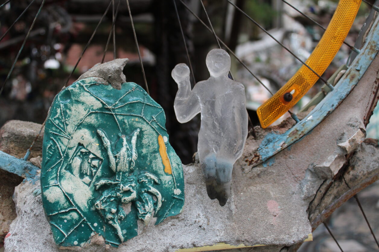 A small clear glass figure of a person created by Lucartha Kohler