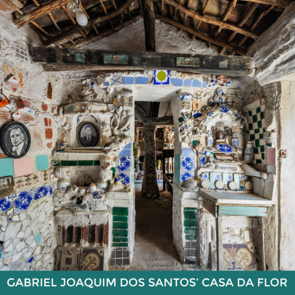 Gabriel Joaquim Dos Santos’ Casa Da Flor. The interior of a room with walls covered in bits of ceramic and tiles. 