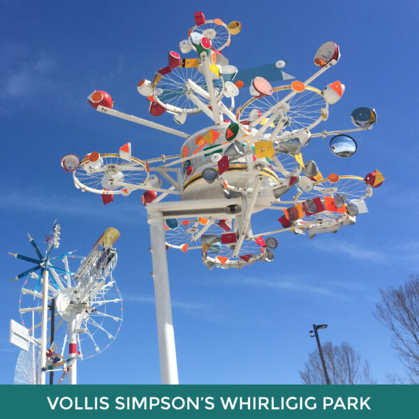 Vollis Simpson’s Whirligig Park. A primarily white sculpture made of bike wheels, mirrors, and colorful bits of reflectors.