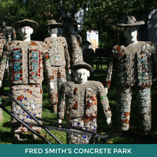 Fred Smith’s Wisconsin Concrete Park. Cement sculptures of people wearing hats and clothing decorated with pieces of tile. 