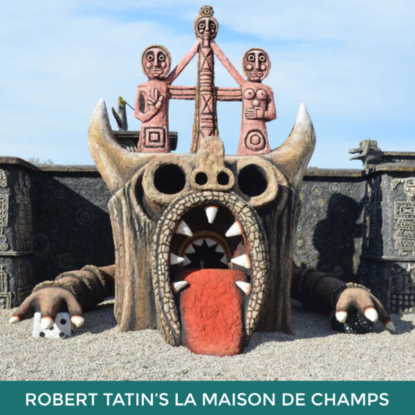 Robert Tatin’s La Maison des Champs. A large creature made from concrete. Its tongue is protruding and it has a mouth of sharp teeth. 