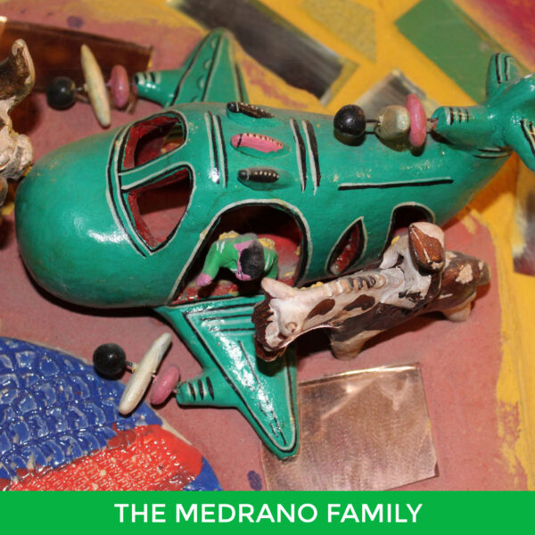 A painted ceramic airplane by the Medrano Family.
