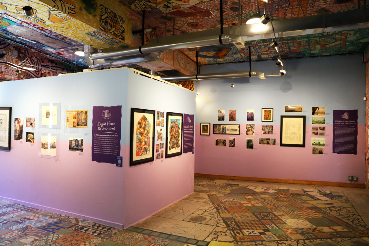 A view of the Back Gallery at Philadelphia's Magic Gardens with a variety of framed works of art on the walls.