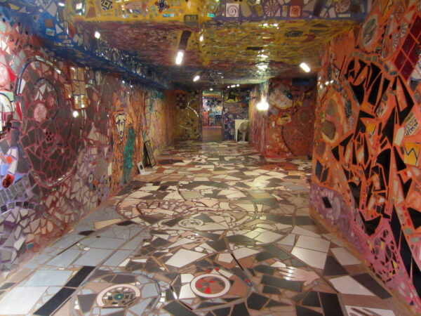Basement with colorful mosaics on the walls, floor, and ceiling
