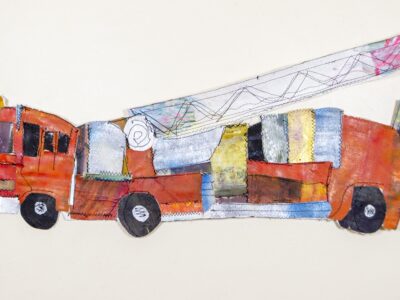 A red firetruck with a white ladder made of fabric sewn together.