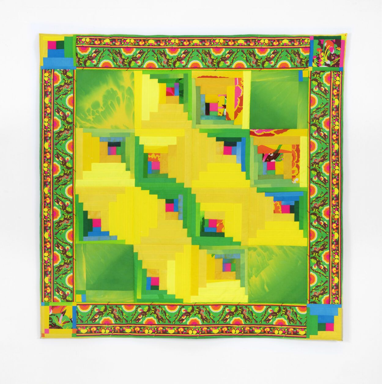 A brightly-colored, quilt-like textile by Katie Kaplan