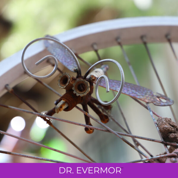 A small winged insect made out of scrap metal.