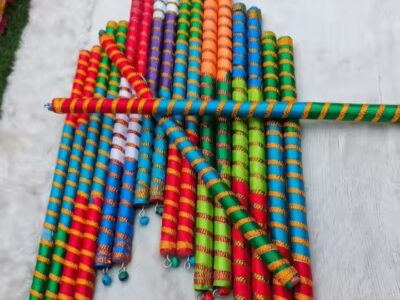 An array of sticks wrapped in colorful ribbons