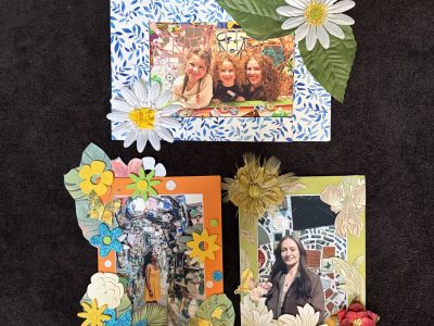 Three photographs of smiling people surrounded by mosaics in the Magic Gardens Museum. Each photograph is in a frame decorated with patterned paper, fabric flowers, plastic leaves, or glittery stickers.
